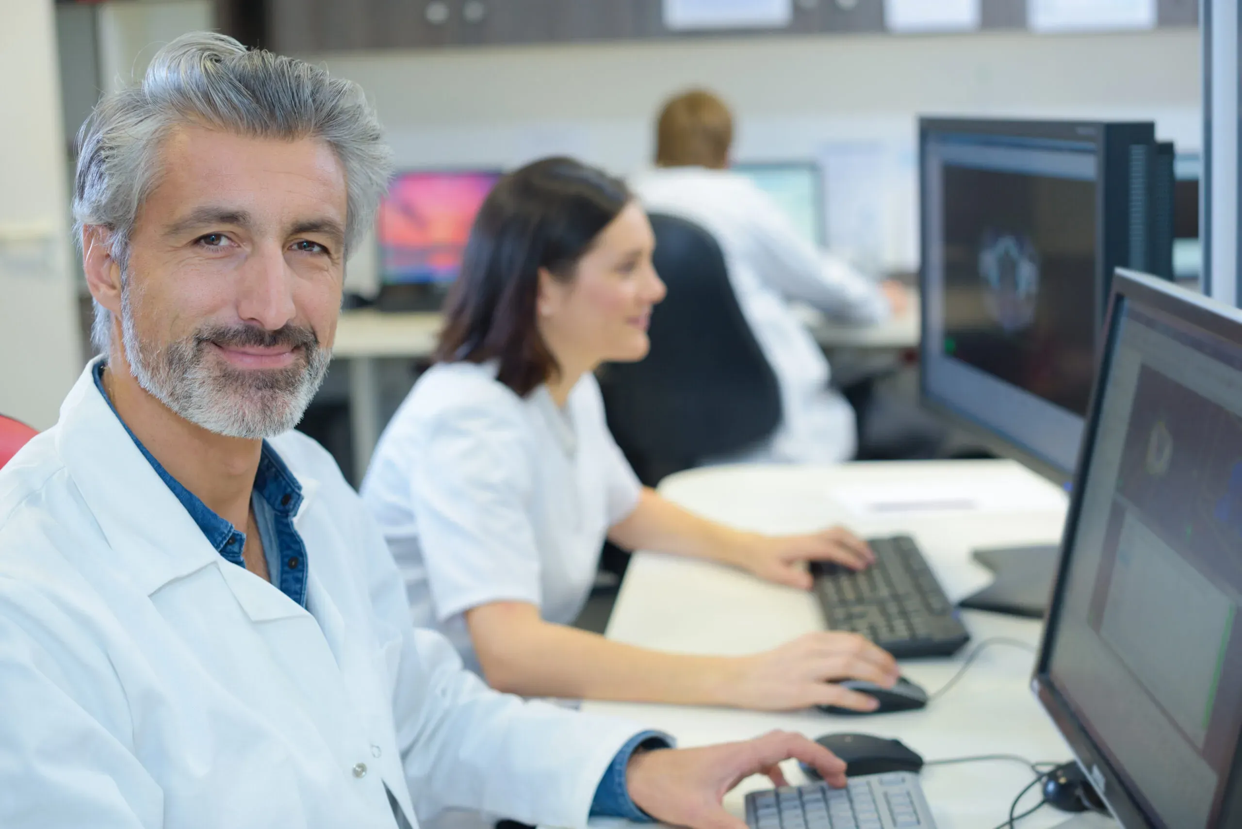 Clinical team reviewing digital wellness analysis screens